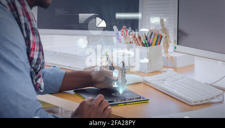 Composition of digital icons and data processing over man using graphic tablet in office Stock Photo
