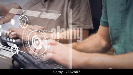 Composition of scope scanning and data processing on screen over men typing on computer keyboards Stock Photo