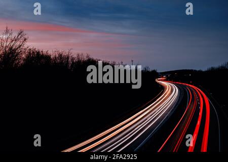 Car light trails at sunset Stock Photo