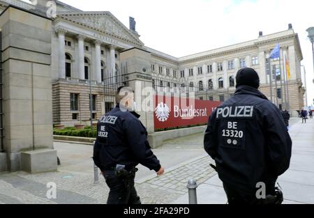 Berlin, Germany. 22nd Apr, 2021. Police officers patrol in front of the Federal Council building in the Mitte district. The parliamentarians take part in a special session of the Bundesrat. The chamber of the Länder discusses the new regulation of the Infection Protection Act. Credit: Wolfgang Kumm/dpa/Alamy Live News Stock Photo