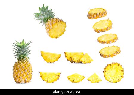 Collection of sliced pineapples and pineapple isolated on white background. Stock Photo