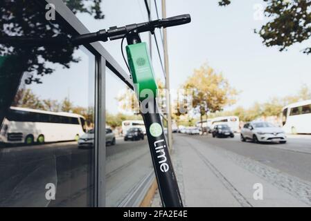 Copenhagen, Denmark - September 14, 2019. Lime scooter parked on a sidewalk in Copenhagen. Stock Photo