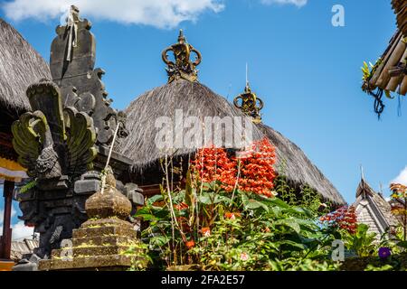 Streets of Desa Penglipuran, traditional village in Bangli Regency, Bali, Indonesia. Traditional Balinese houses with family altars. Stock Photo