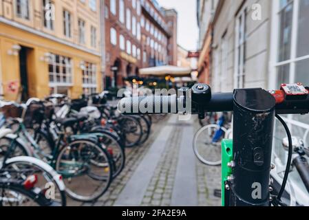 Copenhagen, Denmark - September 14, 2019. Lime scooter parked on a sidewalk in Copenhagen Stock Photo