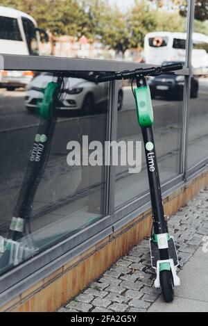 Copenhagen, Denmark - September 14, 2019. Lime scooter parked on a sidewalk in Copenhagen. Stock Photo