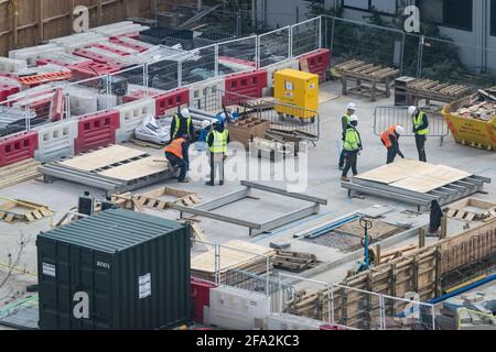 construction workers receiving hands-on training on site Stock Photo