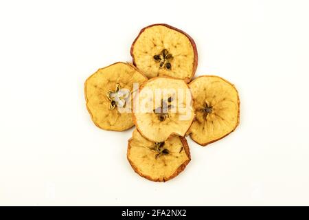Dried apple chips slices composition isolated on white background. Top above view. Flat lay Stock Photo