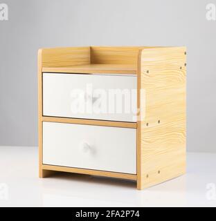 wooden modern bedside with two drawers isolated on white background Stock Photo