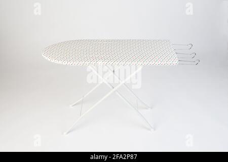Polka dots ironing board isolated on white background Stock Photo