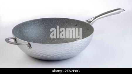 Empty frying metal pan isolated on white background Stock Photo
