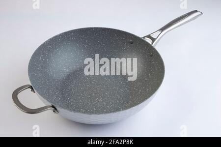 Empty frying metal pan isolated on white background Stock Photo