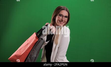 Young pretty woman with shopping bags on shopping tour Stock Photo