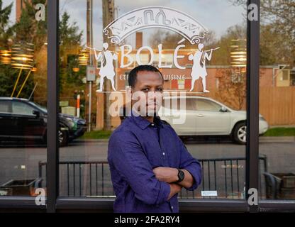 Minneapolis, United States. 22nd Apr, 2021. Solomon Hailie, owner of 'Bole' Ethiopian Restaurant, poses in front of his restaurant in Minneapolis, Minnesota, on Tuesday, April 20, 2021. The restaurant was destroyed in the riots following the death of George Floyd in 2020, and the community raised over $100,000 to help with rebuilding. 'I wanted to create a safe place for everybody of all races, all human beings and I believe Ethiopian food helps to create such a place', said Hailie. Photo by Jemal Countess/UPI Credit: UPI/Alamy Live News Stock Photo