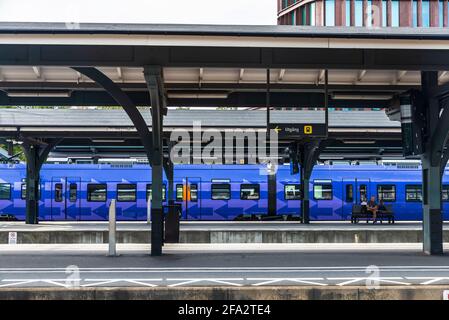 Lund, Sweden - August 30, 2019: Lund railway station, central railway station with people waiting in Lund, Scania, Sweden Stock Photo