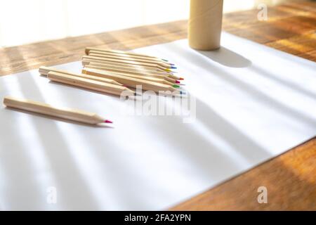 arts and craft hobbies concept, blue and black acrylic painting with colors  in plastic cups and mixed painting tools next to it while the work is in p  Stock Photo - Alamy