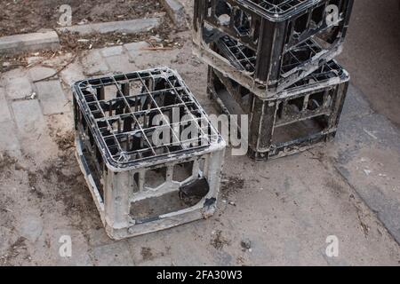 an old plastic bottle crates in the warehouse lie Stock Photo