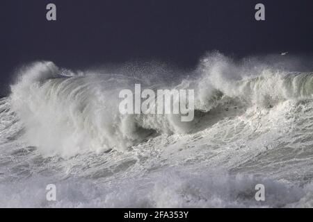 Stormy breaking sea wave against dark sky. Northern portuguese coast during winter. Stock Photo