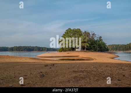 A severe drought in autumn on Lake lanier in Georgia with the shoreline exposed to beaver island which is normally underwater only access by boat Stock Photo