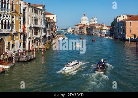 Venice, Venice Province, Veneto Region, Italy. View down Grand Canal to Santa Maria della Salute.  Venice and its lagoon are a UNESCO World Heritage S Stock Photo