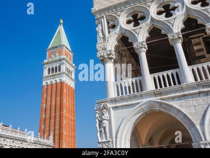 Venice, Veneto Region, Italy. The Campanile, or bell tower, left, and the Palazzo Ducale, or Ducal palace, right, seen from the Piazzetta, off St Mark Stock Photo