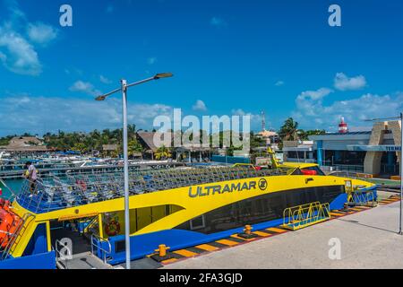 ISLA MUJERES - MARCH 13.2021: View of the ferry port with the boat Ultramar in Isla Mujeres, Cancun, Mexico. Stock Photo