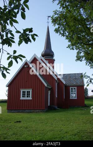 Flakstad Kirke, a little red church with an onion dome in the small island,Flakstadøya in the Lofoten archipelago. Stock Photo