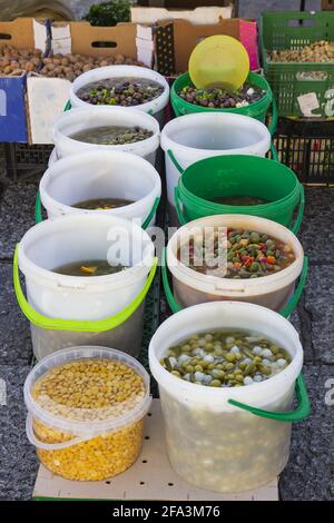 Top view of several different types of olives in translucid cups in the street market Stock Photo