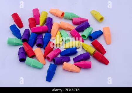 Colorful pencil erasers on white background Stock Photo