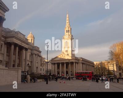 London, Greater London, England - Apr 17 2021: Trafalgar Sq with St Martin in the Fields Church middle and National Gallery left. Stock Photo