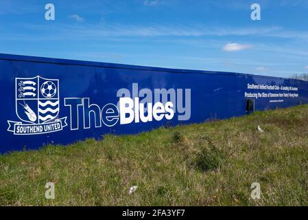 Building site hoarding around proposed Southend Utd football club new stadium training ground in Fossetts Way, Fossetts Farm. The Blues, club crest Stock Photo