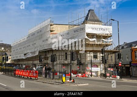 Pontypridd, Wales - April 2021: Scaffolding around the old County Cinema in Pontypridd town centre, which is being converted into housing. Stock Photo