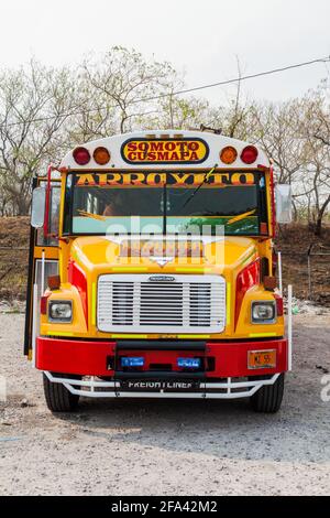 SOMOTO, NICARAGUA - APRIL 24, 2016: Colourful chicken bus, former US school bus, at the bus terminal in Somoto town. Stock Photo