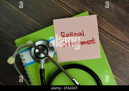Retinal Detachment write on sticky notes isolated on Wooden Table. Stock Photo