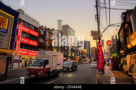 Osaka, Japan - November 5 2020: Early evening view of light traffic on a road in central Osaka under a clear sky Stock Photo