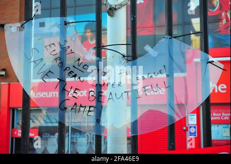 Banners attached to the fence and gates of Liverpool Football Club by fans protesting about the clubs intention to join a European Super League. Stock Photo