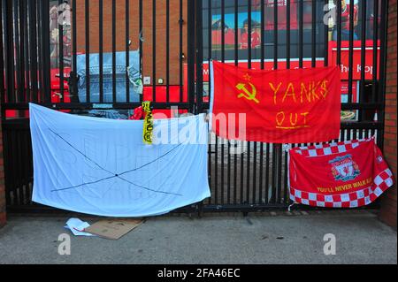 Banners attached to the fence and gates of Liverpool Football Club by fans protesting about the clubs intention to join a European Super League. Stock Photo