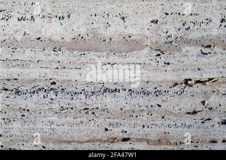 Closeup of a piece of travertine marble, Italian marble worn by time, copy space Stock Photo