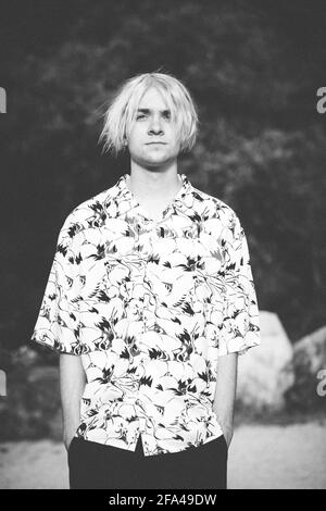 Straight on Black and White Portrait of a Teen Boy with Heron Shirt