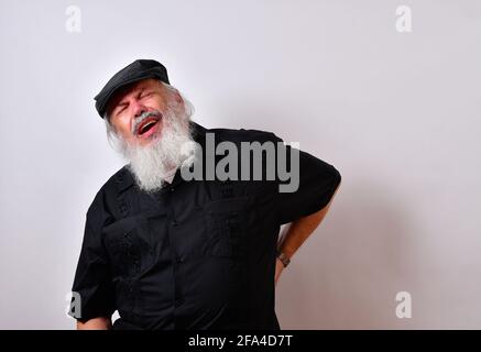 Senior man suffering from severe back pain Stock Photo