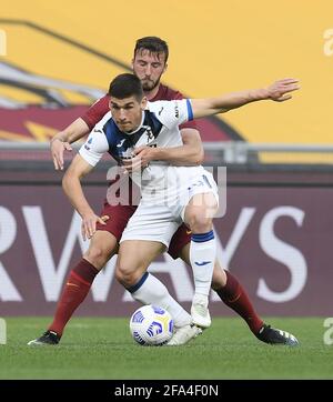Rome, Italy. 22nd Apr, 2021. Atalanta's Ruslan Malinovskyi (front) vies with Roma's Bryan Cristante during a Serie A football match between Roma and Atalanta in Rome, Italy, April 22, 2021. Credit: Augusto Casasoli/Xinhua/Alamy Live News Stock Photo