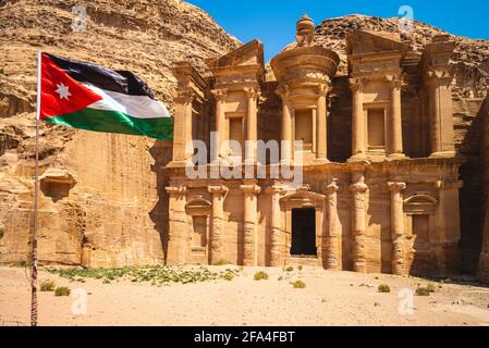 Jordan flag and Ad Deir, aka The Monastery, located at petra, jodan Stock Photo