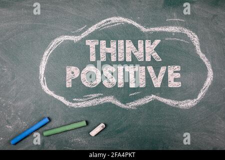 Think Positive. Cloud on a green chalk board. Stock Photo