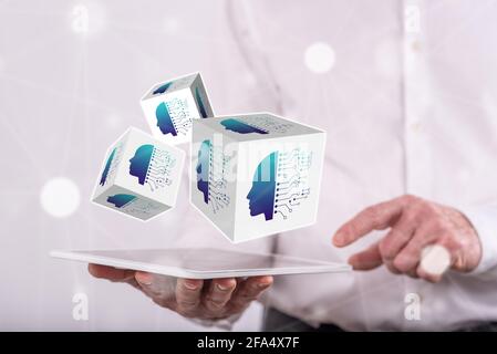 Machine learning concept above a tablet held by a man in background Stock Photo