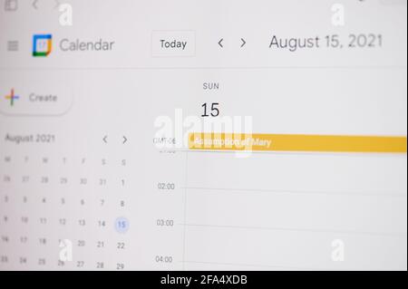 New york, USA - February 17, 2021: Assumption Mary 15 of August on google calendar on laptop screen close up view. Stock Photo