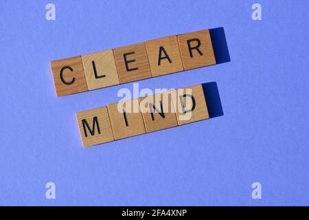 Clear Mind, words in wooden alphabet letters isolated on purple background Stock Photo