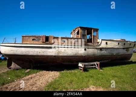 Old sea boat in a salvage yard Stock Photo