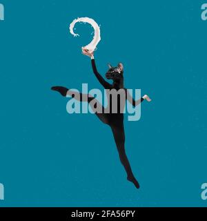 Contemporary art collage, modern design. Retro style. Stylish flexible cat in black suit jumping high with cup, splashing of milk Stock Photo