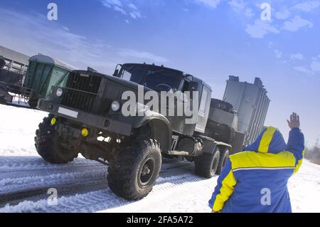 Loading of the big truck by a heavy cargo Stock Photo
