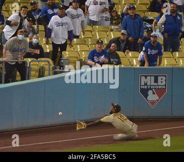 Los Angeles, Unite States. 23rd Apr, 2021. San Diego Padres' left fielder Jurickson Profar slides as he just misses the ball, hit by Los Angeles Dodgers' catcher Will Smith in the eighth inning at Dodger Stadium in Los Angles on Thursday, April 22, 2021. The ump called it a foul, but on review, it clearly hit the line, so Smith was given a double, with Justin going to third. The The Padres defeated the Dodgers 3-2. Photo by Jim Ruymen/UPI Credit: UPI/Alamy Live News