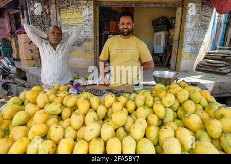 Ujjain, India - March 2021: A man selling mangoes on a street in Ujjain on March 24, 2021 in Madhya Pradesh, India. Stock Photo